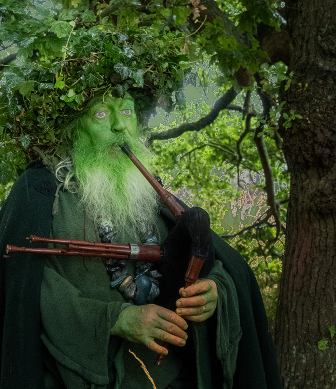 Green Man playing pipes