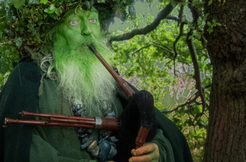 Green Man playing pipes
